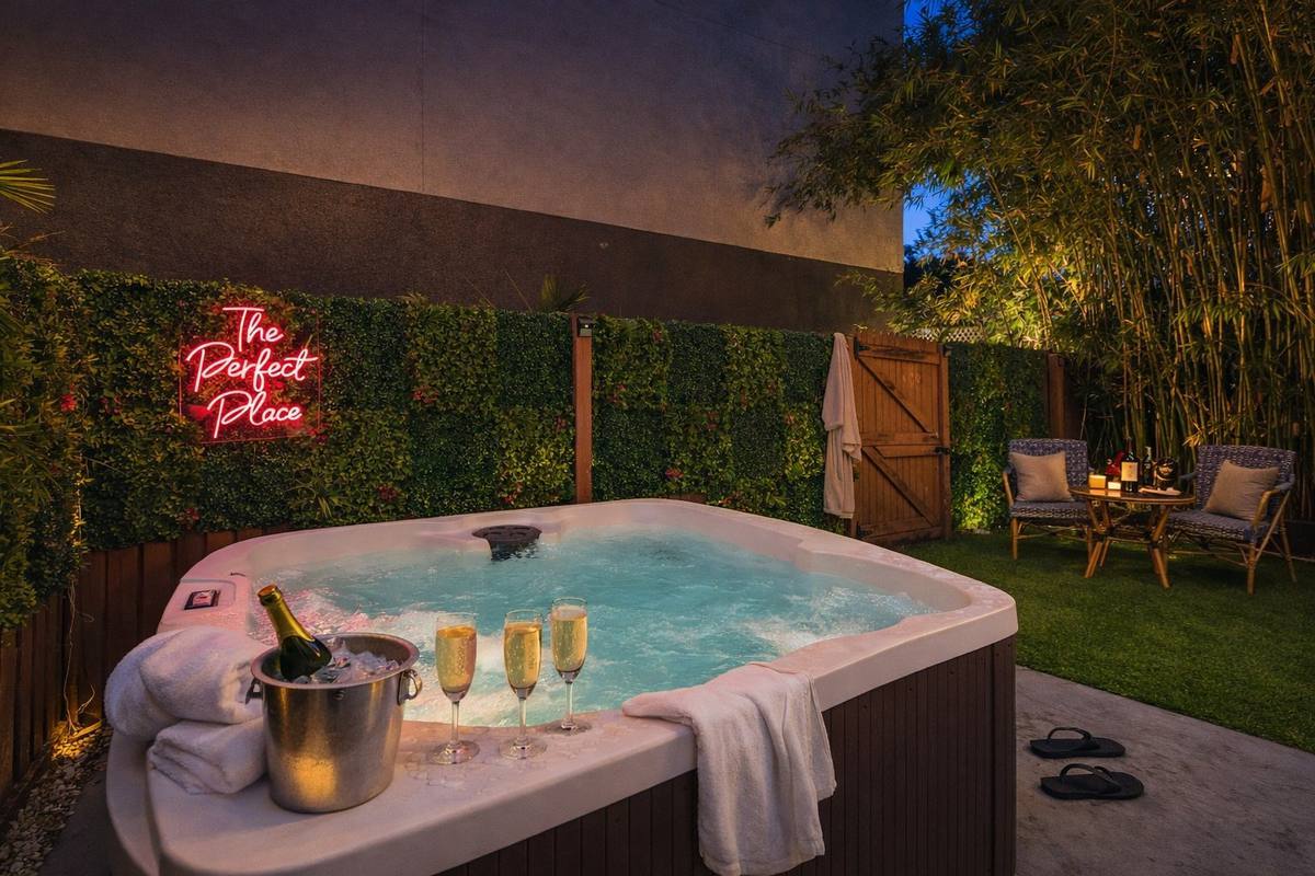 Private outdoor hot tub with champagne setup at St. Pete bungalow rental