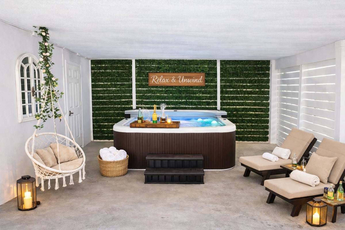Private hot tub on green wall patio at Indian Rocks Beach coastal home