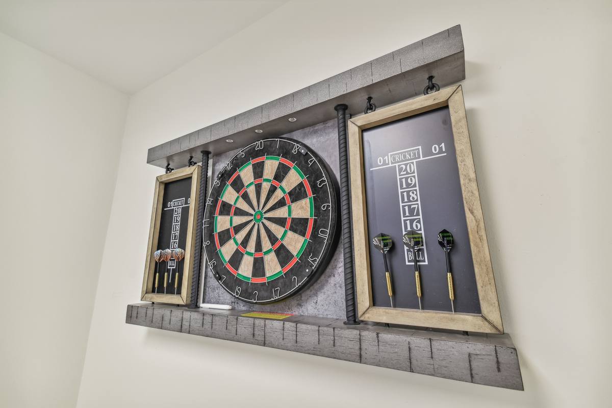 Custom dartboard game room at St. Pete 1-bedroom vacation rental
