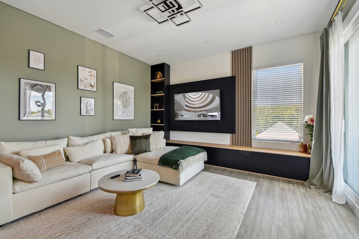 Editorial living room with sectional and styled coffee table at St. Pete retreat