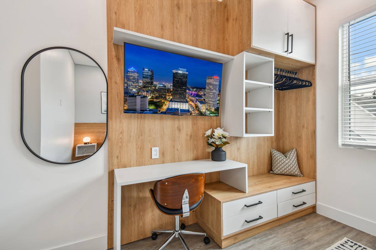 King bedroom with St. Pete skyline art at downtown sun-soaked rental