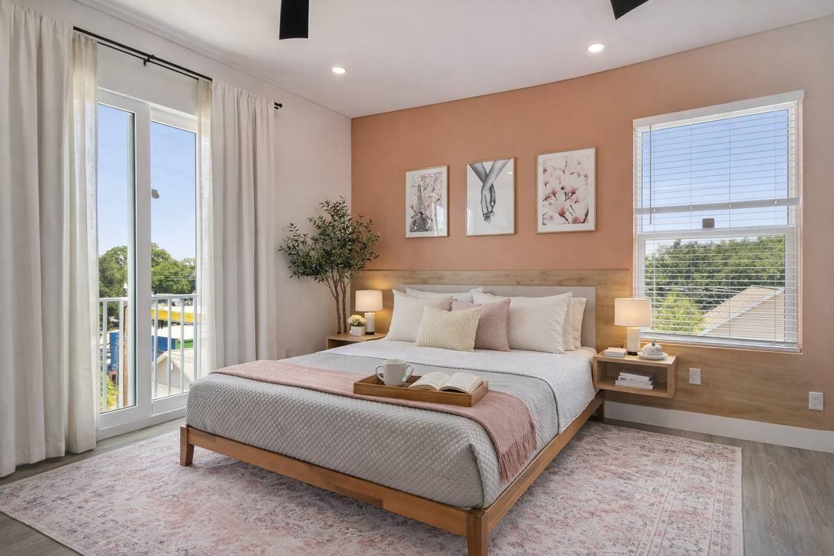 Sage-toned living room with built-ins and curated art at St. Pete modern rental