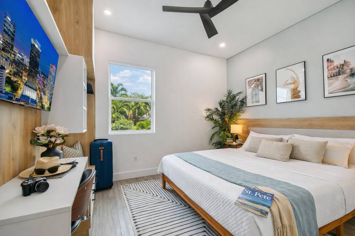 Second king bedroom with skyline art and natural light at St. Pete condo