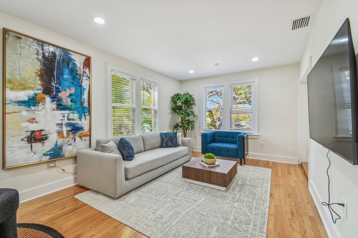Living room with bold abstract art and natural light at St. Pete bungalow